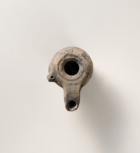Terracotta oil lamp