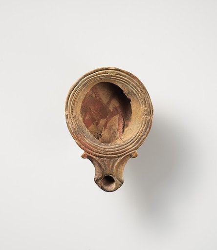 Terracotta oil lamp
