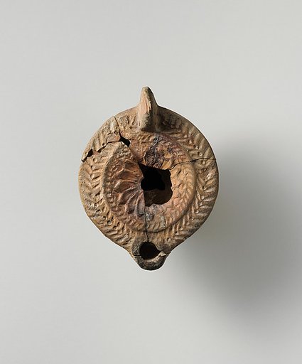 Terracotta oil lamp