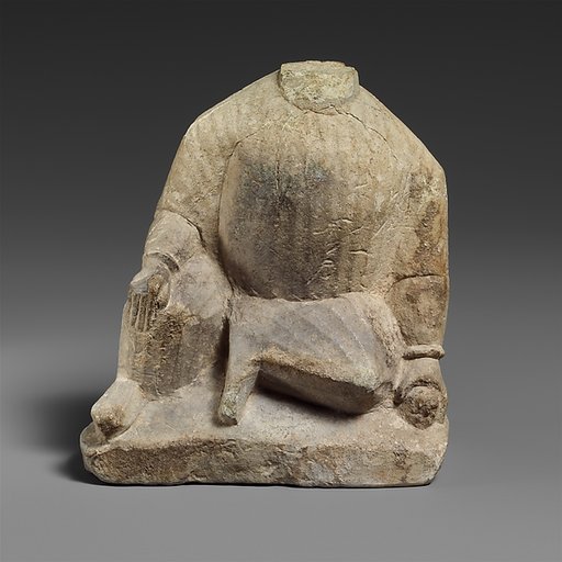 Limestone statuette of a temple boy