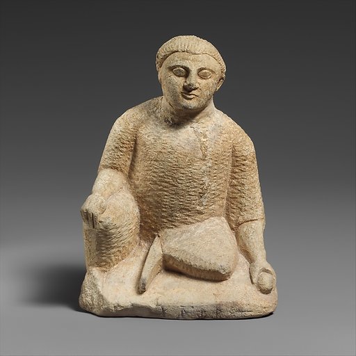 Limestone statuette of a temple boy