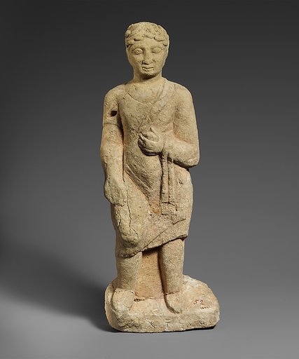 Limestone statuette of a beardless male votary with a wreath of leaves