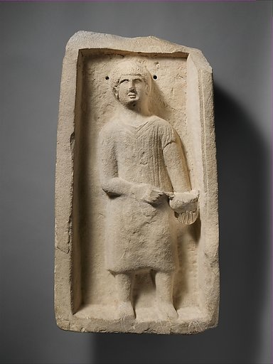 Limestone funerary stele of a boy