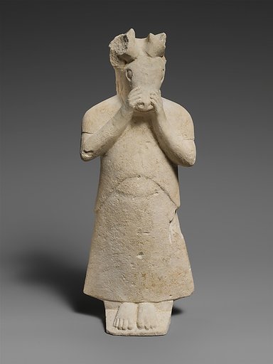Limestone figure with mask