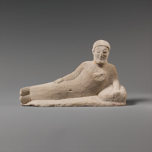 Limestone statuette of a reclining banqueter
