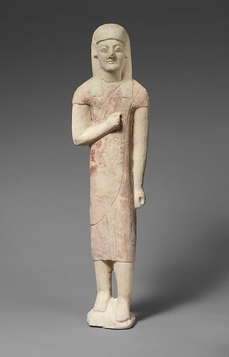 Limestone statuette of a beardless male votary in Greek dress