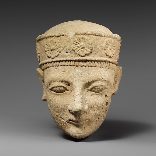 Limestone head of a beardless male with a diadem