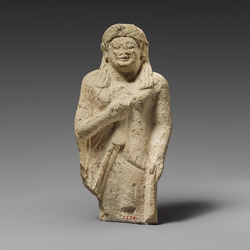 Limestone statuette of a female votary of the kore type