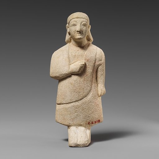 Limestone statuette of a male votary with a plain headdress