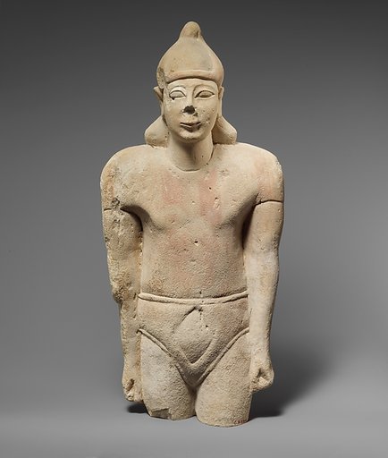Limestone statuette of a male votary with Cypriot shorts and an Egyptian crown