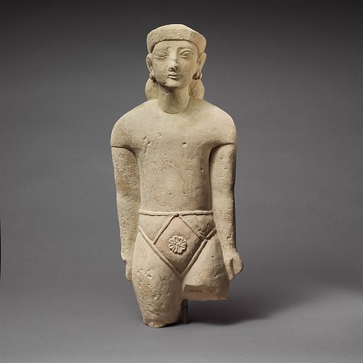 Limestone statuette of a male votary with Cypriot shorts and a diadem