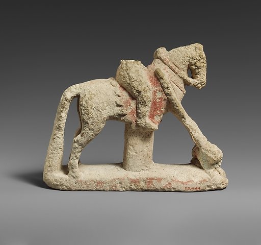 Limestone horse with a rider hunting a lion