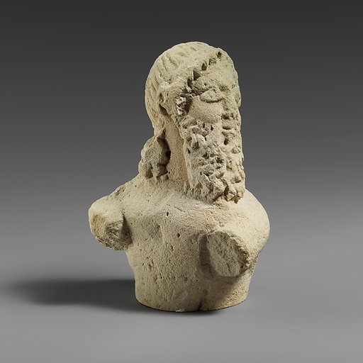 Fragment of a limestone statuette of a silen (?)