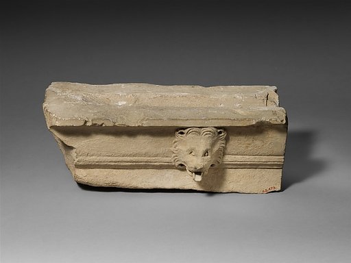 Limestone cornice with a lion’s head