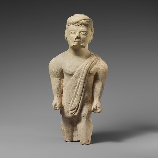 Limestone statuette of a bearded male votary in Greek dress