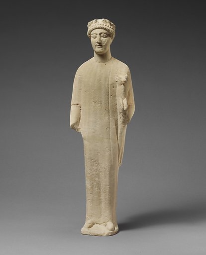 Limestone statuette of a beardless male votary with a wreath of leaves