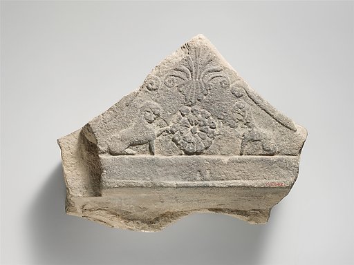 Limestone finial of a funerary stele