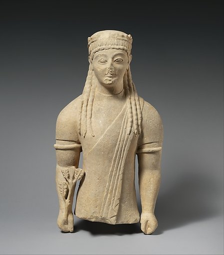 Limestone statue of a beardless male votary with a wreath of leaves