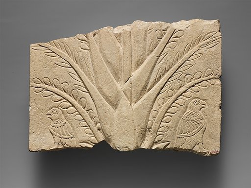 Fragment of a limestone relief with a tree and birds of prey