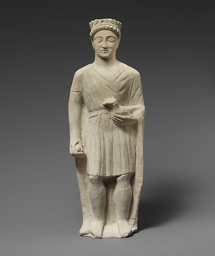 Limestone statuette of a beardless male votary holding a bird