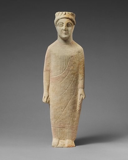 Limestone statuette of a beardless male votary with a wreath of leaves