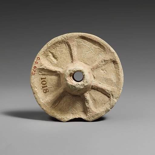 Limestone chariot wheel
