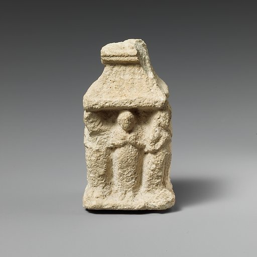 Limestone naiskos with female figures holding their breasts