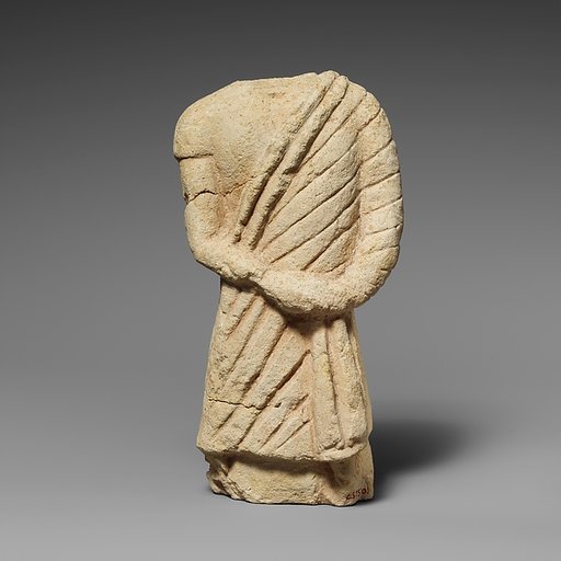 Fragment of a limestone statuette of a male votary
