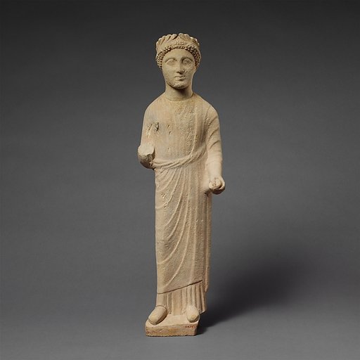 Limestone statuette of a beardless male votary with a wreath of leaves