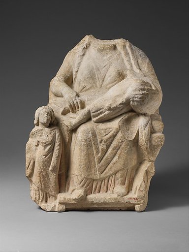 Seated limestone kourotrophos with another child standing
