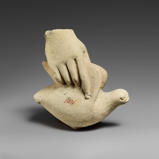 Limestone hand holding a dove