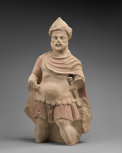 Limestone statue of a bearded warrior