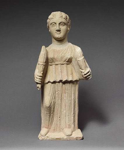 Limestone statuette of Artemis (?) holding two torches