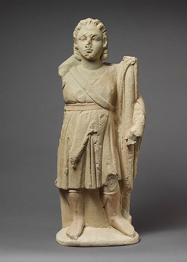 Limestone statuette of Dionysos holding a thyrsos
