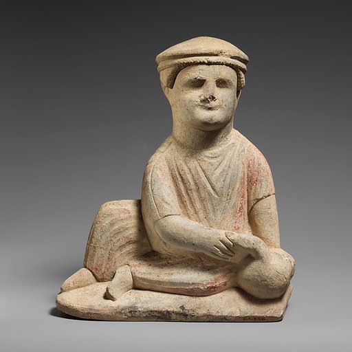 Limestone statuette of a temple boy