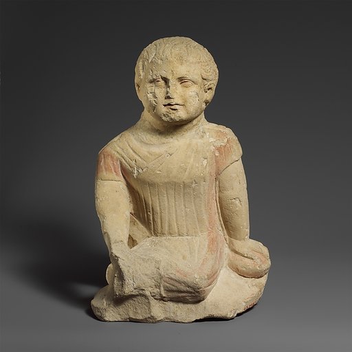 Limestone statuette of a temple boy