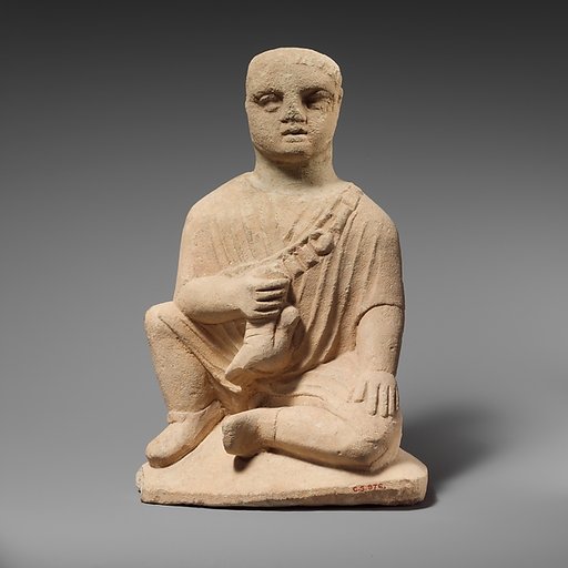 Limestone statuette of a temple boy