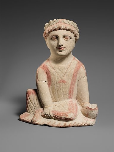 Limestone statuette of a temple boy