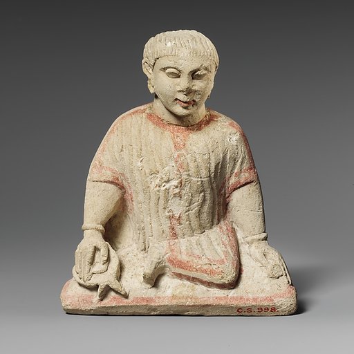 Limestone statuette of a temple boy