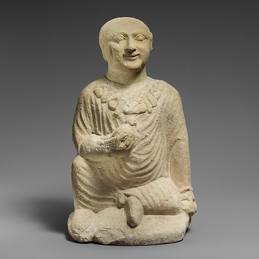 Limestone statuette of a temple boy