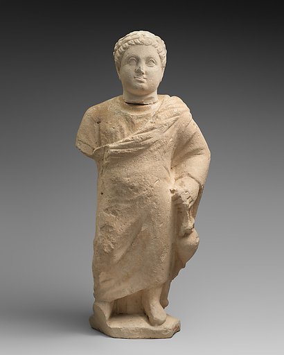 Limestone statuette of a boy holding an amphora