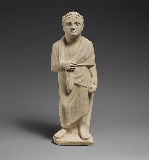Limestone statuette of a boy holding a pyxis