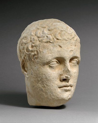 Limestone head of a beardless male votary