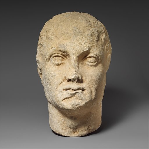 Limestone head of a beardless male votary