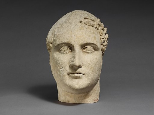 Limestone head of a beardless male votary