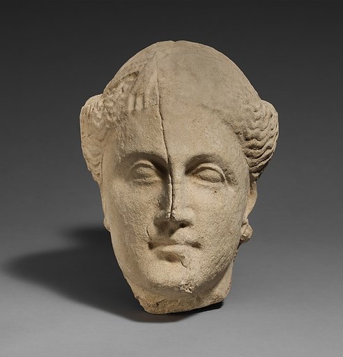 Limestone head of a female votary