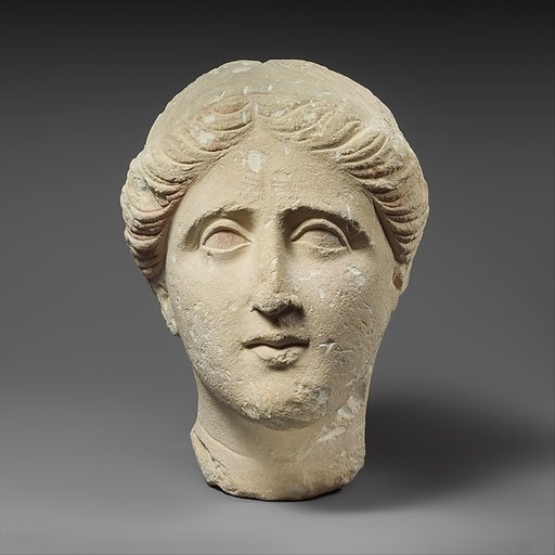 Limestone head of a female votary