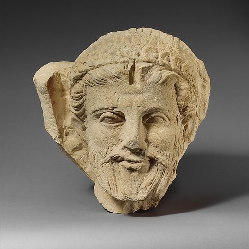 Limestone head of a bearded man from a funerary stele