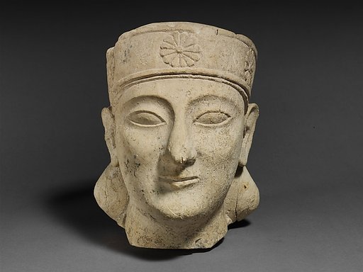 Limestone head of a beardless male with a diadem
