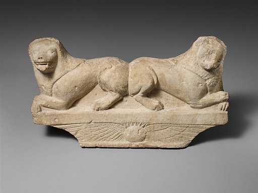 Limestone finial of a funerary stele with two recumbent lions